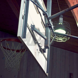 Basketball Hoop Inside of a Gymnasium with Wooden Walls