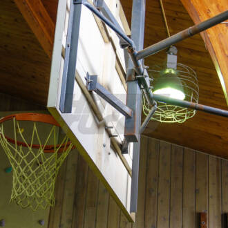 Basketball Hoop and Backboard in a Gymnasium